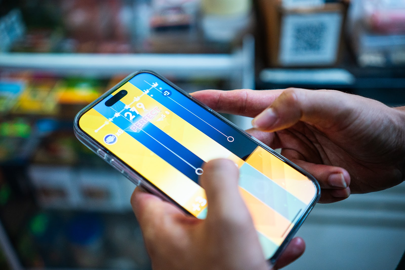 A user plays Amanotes on their mobile device